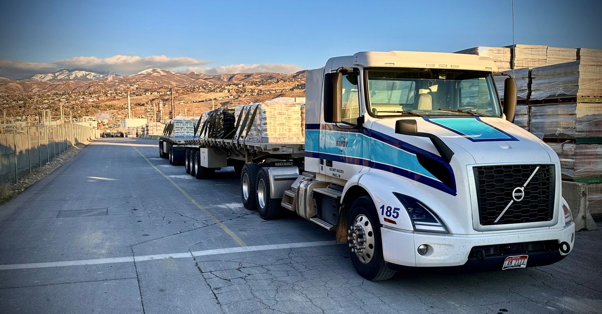 Handy Truck Line flatbed truck loaded with palletized materials