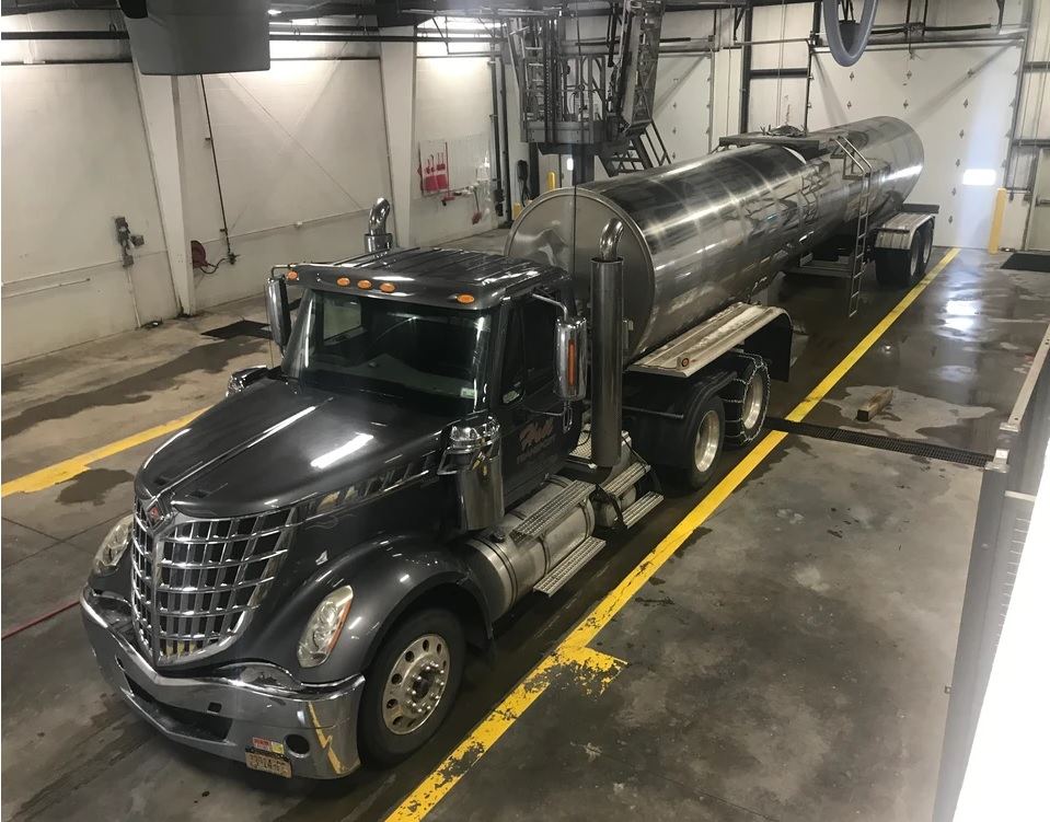 Tanker trailer in an interior tank wash bay